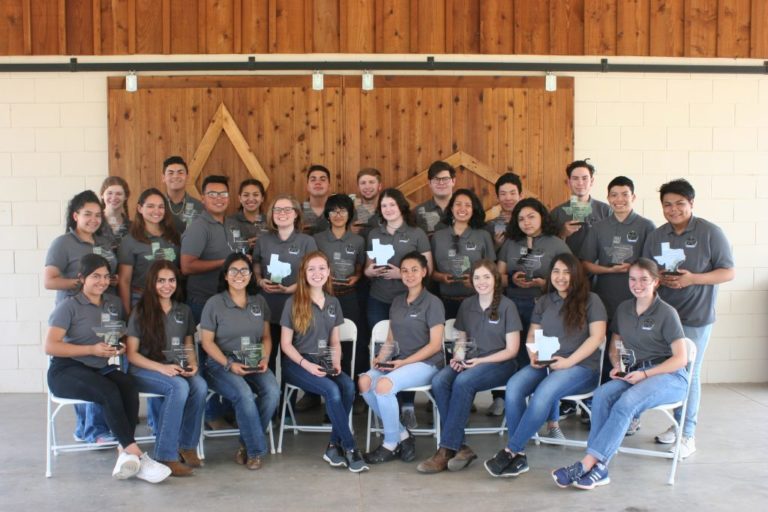 Group photo of teenagers and their awards