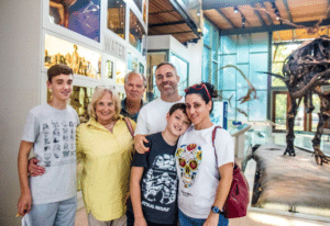 family in dinosaur exhibit