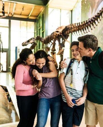 family in dinosaur exhibit