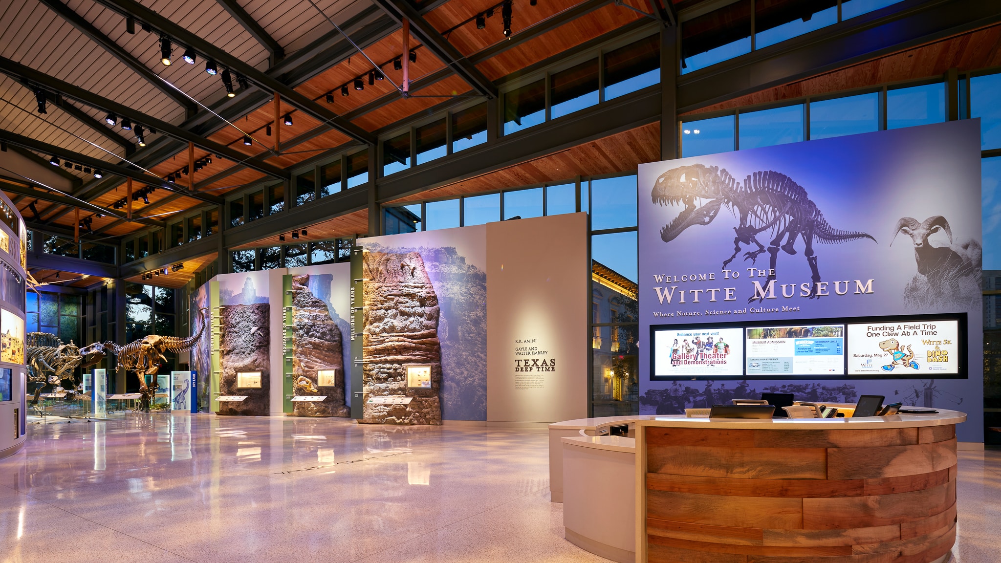 Valero great hall at Witte Museum with dinosaurs, admissions desk, and Texas geology