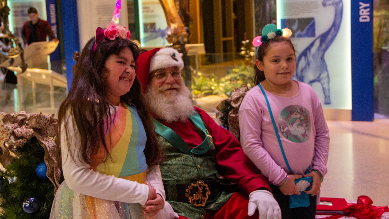 two girls with santa claus