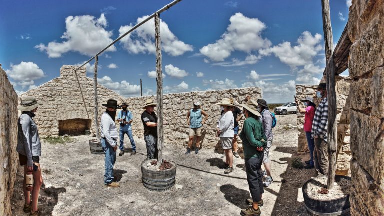 Group of people in old building.