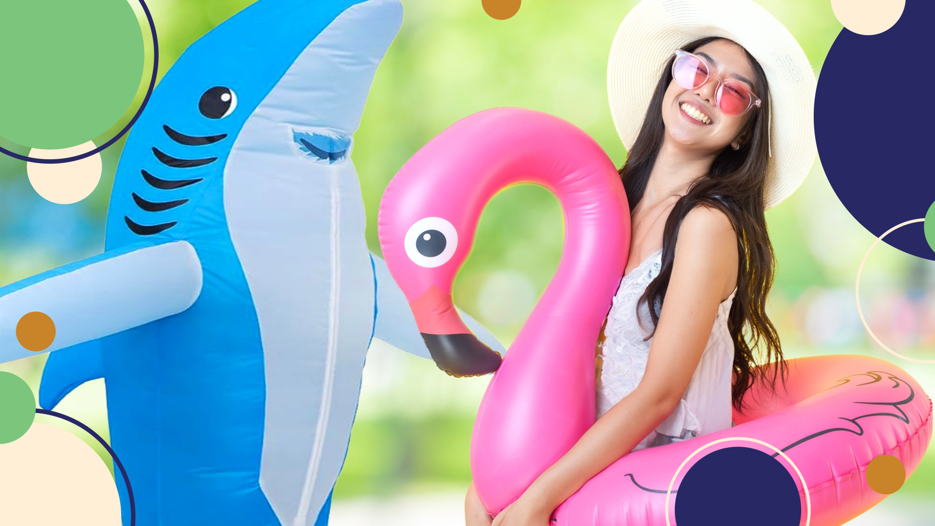 Woman wearing flamingo pool floatie stands next to inflatable shark.